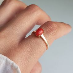 RING DETAILS: ✪Design: Gold ring ✪Gemstone: Natural coral ✪Gemstone color: Red ✪Gemstone size: 7x5mm ✪Gemstone shape: Oval ✪Setting type: Prong ✪Metal type: 14k solid yellow gold (also available in white and rose gold) ✪Metal finish: Smooth shiny Choose your ring size from drop down menu and if you need any other preferred ring size please contact us. QUALITY OF MATERIALS: Metal: Most of our jewelry at JewelryMansion is made with precious metals like gold and silver. These metals are 100% non-al Coral Stone Ring Design For Women, Ring Design Without Stone, Red Coral Ring Design Women, Red 14k Gold Ring With Gemstone Accents, Coral Ring Designs For Women, Coral Stone Ring, Stone Ring Design, Red Coral Ring, October Birthstone Ring