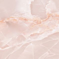 an abstract marble background with gold and white highlights on the top right corner, in soft pink tones