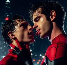 two people are kissing in the rain with their faces covered by red and black clothes