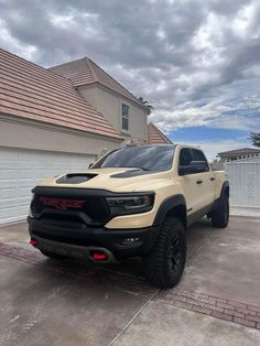 a white truck parked in front of a house