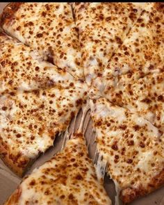 the pizza is cut into four pieces and ready to be eaten with cheese on it