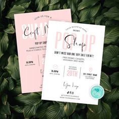 two pink and white wedding cards with the word pop up on them, sitting in front of some green leaves