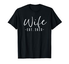 a black t - shirt that says wife est 2013