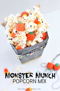 a halloween popcorn mix in a metal container