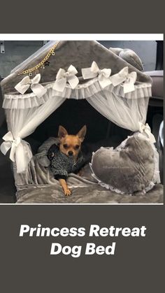 a small dog sitting in a bed made to look like it is being held by a stuffed animal