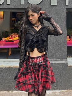 Embrace the Y2K fashion trend with this edgy and unique punk plaid skirt. Featuring a high-waisted A-line silhouette and an irregular hem, this skirt exudes a cool and alternative vibe. Perfect for the summer season, this standout piece is a must-have for those who love to express their individual style.  Please note that this product includes only the skirt or a set.  Garment Size   	 		 			Size 			S 			M 			L 		 		 			Waist 			63 			67 			71 		 		 			Full Length 			35 			36 			37 Edgy Plaid Mini Skirt, Fitted Emo Mini Skirt For Summer, Emo Style Mini Skirt For Summer, Summer Emo Style Mini Skirt, Gothic Streetwear Skirt For Spring, Gothic Spring Streetwear Skirt, Emo Mini Skirt For Summer Alternative Fashion, Gothic Style Skirt For Spring Streetwear, Gothic Streetwear Skirt For Summer