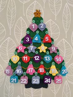 a crocheted christmas tree with numbers on it