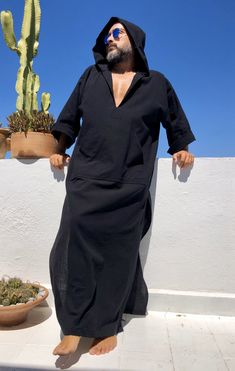 Men's loose caftan Linen kaftan for men Lightweight linen İt's a special kind of linen which is only made in Anatolia ( i uploaded the fabric's detailed picture ) Black color Surfers linen robe Cover up Hand made Small to 4XL size options Feel free to Ask for custom sizes or customization Front pocket - kangaroo pocket Best for gift ... worldwide fast shipping custom made requests accepted to visit my shop: www.etsy.com/shop/mnouss/ to follow us on instagram: https://www.instagram.com/mnoussoffi Black Long Sleeve Thobe For Summer, Black Long Thobe For Summer, Casual Black Tunic Kaftan, Greece Fashion, Black Kaftan, Linen Robe