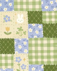 a green and blue patchwork quilt with white flowers on the front, an image of a rabbit in the center