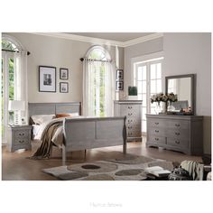 a bedroom scene complete with a bed, dresser and mirror on the wall in front of two windows