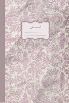 a pink and white floral pattern with a name tag on the back of it's cover