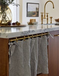 the kitchen counter is clean and ready to be used as a towel rack for drying dishes