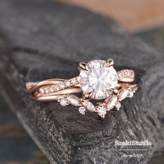 a close up of a ring on top of a rock