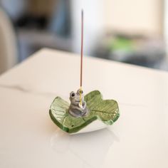 🌟 Elevate Your Space with Elegance and Whimsy! Introducing the Exquisite Handmade Ceramic Incense Holder - Frog On Leaf 🌱 Are you a true connoisseur of home decor? Do you find solace in the fragrant embrace of incense? Seeking an exceptional gift that resonates beyond ordinary choices? Look no further! Our meticulously crafted Incense Holder, featuring an enchanting frog perched on a delicate leaf, is here to captivate your senses and transform your surroundings. 🎁 Perfect Gift for Every Occasion Embrace the artistry of gifting with this delightful masterpiece. Our Incense Holder is not just an item; it's a thoughtful gesture that will linger in the recipient's heart. Be it a birthday, housewarming, or simply an expression of appreciation, this ceramic wonder is a unique gift that speak Clay Incense Stick Holder, Inscene Holder Clay, Quirky Incense Holder, Pottery Incense Holder, Hand Built Pottery Incense Holder, Frog Incense Holder, Leaf Incense Holder, Long Incense Holder Ceramic, Diy Incense Holder