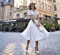 "This swing dress is a 50s inspired shirtwaist dress , featuring classic open neck, notched collar, and center front button closure, finished with a swing skirt, and handy side seam pockets. More colors https://etsy.me/3wWb0UN DETAILS * The model wears a white petticoat, if you want click: https://etsy.me/3O6Dbbf * The model's belt is not for sale * 50% cotton, others are polyester * No liner * Two seam pockets * Front Button up closure * Short sleeve * Notched collar * with fabric Belted * Belo Chic A-line Vintage Dress For Casual Wear, White Vintage Summer Party Dress, Chic Fitted Spring Vintage Dress, White Knee-length Vintage Party Dress, Classic Fit And Flare Summer Dress, Classic White Midi Dress For Day Out, Summer White Vintage Dress, Chic A-line Vintage Dress For Garden Party, White Vintage Dress For Spring Party