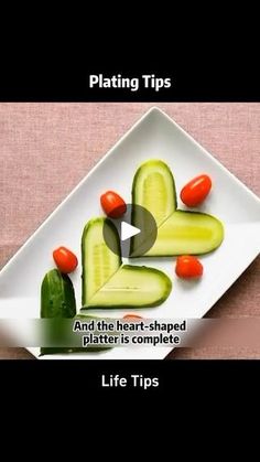 a white plate topped with cucumbers and tomatoes