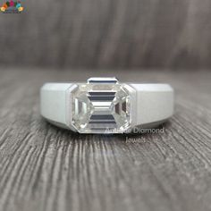 a diamond ring sitting on top of a wooden table