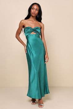 You'll be looking especially extraordinary in the Lulus So Rare Emerald Green Satin Strapless Twist-Front Midi Dress! Glossy woven satin shapes this head-turning dress that falls from a strapless, sweetheart neckline (with hidden no-slip strips) into a pleated, twist-front bodice that creates a flirty cutout. The high, fitted waist sits atop a figure-skimming slip skirt that finishes at a chic midi hem. Turn around to reveal two elasticized straps that lay across the otherwise open-back design. Long Guest Wedding Dress, Formal Wedding Guest Dress Summer Classy, Emerald Long Dress, Grad Party Dresses, Lulus Prom Dress, Green Long Dresses, Emerald Green Maxi Dress, Teal Green Dress, Head Turning Dress