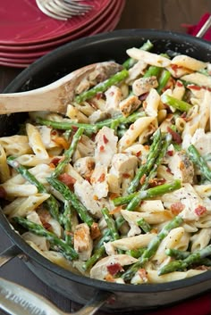 pasta with chicken and asparagus in a skillet