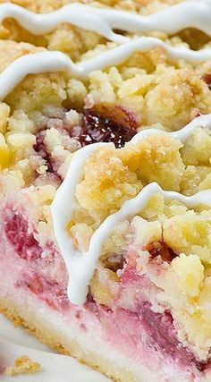 a close up of a piece of cake on a plate with icing and crumbs