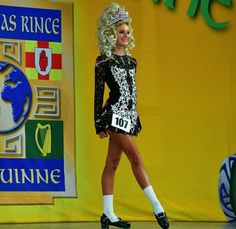 a model walks down the runway in a costume