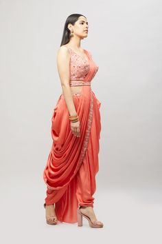 Modern, fun and chic! This readymade coral dhoti saree with multi-resham embroidery is perfect for any bridal event! Fabric: Satin silk Ready to Ship Occasion: Sangeet, Mehendi Events WASH CARE INSTRUCTIONS - Please Dry clean only when it is applicable. Slight color variation is possible due to digital photography. Jewelry not included Navratri Floor-length Dola Silk Pre-draped Saree, Bollywood Style Pre-draped Saree In Raw Silk, Traditional Drape Pre-draped Saree For Wedding And Navratri, Designer Draped Traditional Wear With Resham Embroidery, Bollywood Style Art Silk Pre-draped Saree For Reception, Embroidered Draped Choli For Wedding, Festive Draped Traditional Wear With Resham Embroidery, Festive Draped Embroidered Traditional Wear, Wedding Embroidered Draped Choli