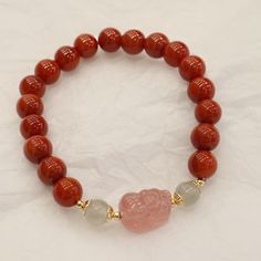 Style: Original Design Material: South Red Color: 8mm Natural South Red Strawberry Quartz Pi Xiu Bracelet Fashion Element: Color Matching, Three-Dimensional Decoration Spiritual Red Jade Jewelry, Red Spiritual Crystal Bracelet With Natural Stones, Red Crystal Bracelet With Natural Stones For Healing, Spiritual Red Crystal Bracelet With Natural Stones, Traditional Red Bracelets With 8mm Beads, Red Beaded Bracelets With Gemstone Beads, Traditional Red Bracelets For Meditation, Elegant Red Beaded Bracelets For Meditation, Red Natural Stones Crystal Bracelet