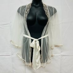 -Elegant White Robe -Made Of Sheer Tulle -Floral Embroidery & Leafy Trims -Wide Satin Waistband -Perfect As A Bridal Robe Or Sexy Sleepwear -Can Be Worn For Boudoir Photography Elegant Cream Sleepwear With Delicate Lace, Elegant White Sheer Sleepwear, Elegant Fitted Cream Sleepwear, Cream Lace-trim Sleepwear For Wedding, Elegant Sheer Cream Sleepwear, Elegant White Sleepwear With Delicate Lace, Elegant Sheer Sleepwear For Wedding Night, Elegant Cream Lace Sleepwear, Cream Wedding Sleepwear With Lace Trim