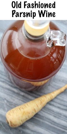 an old fashioned parsnip wine bottle next to a wooden stick