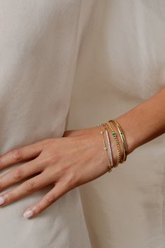 Our Evie Pavé Chain Bracelet showcases one gleaming stone flanked by a bold Cuban chain, designed to ground your bracelet stack. Part of our Stackable Jewelry assortment. Cuban chain bracelet, one claw-set princess cut simulated stone, lobster-claw closure. Gold: 18K gold plated brass. Silver: rhodium plated brass. Nickel- and lead-free. 7" long. Avoid water, soap, and harsh chemicals. Store in a box or bag in a cool, dry place. Clean using a dry soft cloth. Bracelet Stack With Tennis Bracelet, Bracelet Stack Silver And Gold, Silver And Gold Bracelet Stack, Tennis Bracelet Stack, Bracelet Styling, Arm Candies, Silver Bracelet Stack, Gold Bracelets Stacked, Pave Bangle