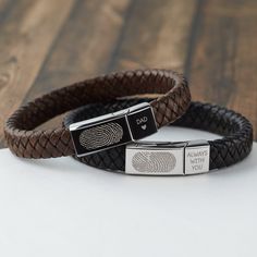 This bracelet is made of woven leather and love. On one side, you can have fingerprint and name of your loved one. On the other, you can also have a memorial meaningful message  ITEM INFO Materials: 2 stainless steel magnetic clasps & PU woven leather Word limits: up to 10 words for the big side, up to 4 words for the small side. Dimensions: Approx. 1''x0.4'' (24x10mm) for the big side and 0.4''x0.4'' ( 10.5x10mm) for the small side Size: Size S: inside circumference 6 1/4 inches (16cm) Size M: Memorial Gifts For Men, Homade Christmas Gifts, Fingerprint Jewelry Memorial, Black And White Hoodies, Memorial Bracelet, Clever Gift, Love You Dad, Fingerprint Jewelry, Christmas Gifts For Him