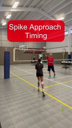 two people are playing with a ball in a large indoor basketball court that says spike approach time