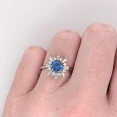 This snowflake-inspired design ring features a 1.11-carat round sapphire gemstone with natural earth-mined diamonds, all set in solid 14K gold. This ring can be a beautiful birthstone gift for your loved ones! This ring is made with solid 14K Gold and naturally Earth-mined SI / G-H diamonds. Diamond Cluster Sapphire Ring, Cluster Sapphire Ring With Diamond Center Stone, Sapphire Cluster Ring With Cubic Zirconia In Round Cut, Sapphire Cluster Ring With Brilliant Cut Cubic Zirconia, Diamond Cluster Birthstone Ring With Center Stone, Sapphire Cluster Ring With Center Stone For Promise, Sapphire Cluster Ring With Center Stone In Cubic Zirconia, 14k Gold Sapphire Cluster Ring With Brilliant Cut, Fine Jewelry Sapphire Cluster Ring With Center Stone