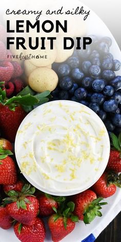 a white plate topped with fruit and dip