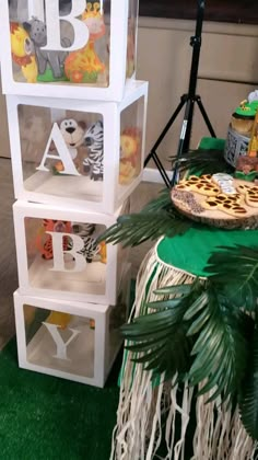 an animal themed birthday party with food and decorations