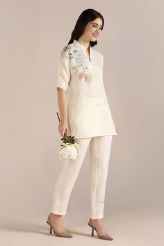 Off white long top, adorned with hand-drawn floral doodles. Paired with coordinating pant. - Aza Fashions White Relaxed Fit Sets For Spring, White Linen Sets For Spring, White Long Pants Sets For Spring, Beige Floral Embroidered Pants For Spring, Linen Sets For Spring With Long Pants, Linen Sets For Spring, Elegant White Floral Print Pants, Elegant White Pants With Floral Print, Off White Floral Print Sets For Spring