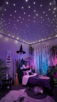 a bedroom decorated in purple and blue with stars on the ceiling