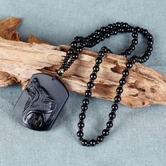 This Natural Obsidian Wolf Head Necklace  is the unique piece that makes your look perfect. A great gift for you and your loved one.💝 🔰QUALITIES: Material ⮞ Obsidian Made with great care and value. 🔰HOW TO ORDER: ⮞ Fill in the Details about your order in personlization box (i.e: Three letter initial), If needed. ⮞ You can contact us before or even after the order. 🔰POLICIES: ⮞ All items are custom made to order. ⮞ Our turn around time is about 6 - 10 business days. This can change during peak seasons. ⮞ We use USPS for Delivery in America. ⮞ If you can't find the information you need or need some advice for your design? Feel free to contact us. We are fast to reply 😊 Obsidian Necklace, Amulet Charm, Wolf Necklace, Hand Carved Stone, Wolf Jewelry, Obsidian Stone, Healing Necklace, Beaded Rope, Wolf Head