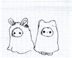 two piggy bags sitting next to each other on top of a sheet of paper