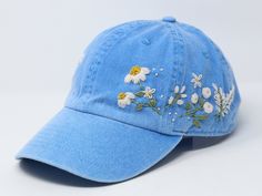 Flower is 100% hand embroidered on a 100% cotton wash baseball cap. Hat is one size fits all with adjustable back strap. Unique cap, one of a kind! I am also open for customization. If you want the item in different colors, please message me, it will take additional 2-3 days of handling time. Free first class shipping, upgradable priority mail service. 30 days return policy, feel confident at your purchase! Cheap Embroidered Cap, Affordable Embroidered Baseball Cap, Spring Blue Baseball Cap With Embroidered Logo, Blue Visor Baseball Cap For Spring, Blue Embroidered Baseball Cap For Summer, Custom Embroidered Hats For Spring, Custom Embroidered Hats For Spring, One Size Fits Most, Adjustable Embroidered Blue Hat, Embroidered Blue Spring Hats