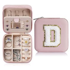 a pink case filled with lots of jewelry