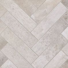 a tile floor with white and gray herringbones on the bottom, in an angle view