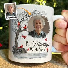 a person holding a coffee mug with an image on it