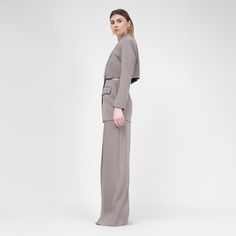 Introducing our standout suit ensemble, featuring a blazer with a waistline cut-out paired with ultra-wide leg trousers for a bold and fashion-forward statement. The blazer boasts a sleek silhouette with a daring waistline cut-out, adding a modern twist to classic tailoring. Complementing the blazer, the ultra-wide leg trousers offer an elegant and dramatic flair, creating a chic and sophisticated look. Crafted with meticulous attention to detail and designed for versatility, this suit ensemble is perfect for making a statement at any occasion, from the office to evening events. Elevate your wardrobe with this unique and stylish ensemble that effortlessly combines sophistication with contemporary edge dry clean only Gray Suit, Gifts For New Mums, Pearl Jewellery Earrings, Shirt Sale, Wide Leg Trousers, Independent Designers Fashion, Gifts For New Moms, Playsuit Jumpsuit, Women Clothes Sale