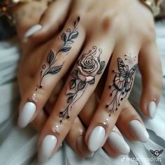 a woman's hand with flowers and butterflies on it