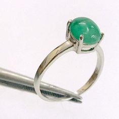 "Green Emerald with 3.8ct stone Ring Handcrafted Indian jewelry. Ring is in .925 Sterling Silver and finished with Rhodium EXCELLENT GIFT: for birthday, anniversary, holidays, stocking stuffers, graduation, Christmas, Valentine's Day, Mother's Day, Thank You or simply \"Thinking of You ALL RING SIZES AVAILABLE: We have our own manufacturing unit. We can deliver all custom ring sizes on request. CONTACT US: If you have any question, please post into \"Customer Questions & Answers\" below the \"Product specifications\".  Product colour may slightly vary due to photographic lighting sources or your monitor settings. Top Quality Craftsmanship Exceptional Styling ENTER OUR SHOP HERE for more fabulous jewelry :  https://www.etsy.com/in-en/shop/JwellsFarms?ref=seller-platform-mcnav" Oval Emerald Ring With Polished Finish, Oval Cabochon Rings For May Birthstone, Oval Fine Jewelry Gemstones For Jewelry Making, Oval Cabochon Emerald Ring Gift, Silver Jade Promise Ring, Silver Jade Rings For Promise, Emerald Oval Cabochon Ring Gift, Oval Green Moonstone Gemstone Ring, Green Oval Moonstone Gemstone Ring