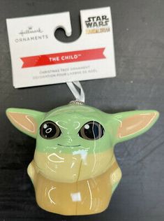 an ornament shaped like the child yoda from star wars