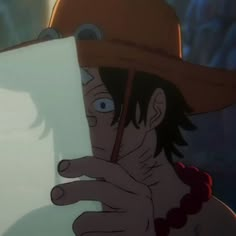 a man in a cowboy hat holding a piece of paper