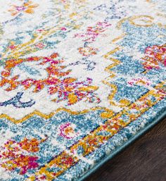 an area rug with colorful flowers on it