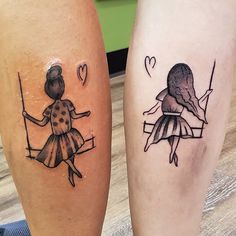 two people with tattoos on their legs, one is holding a swing and the other has a heart